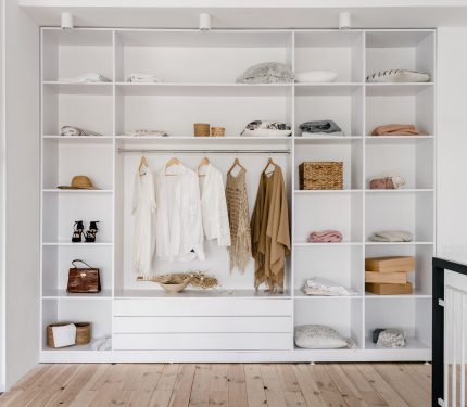 modern and large wardrobe in dressing room with
